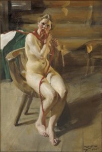 Nude woman arranging her hair